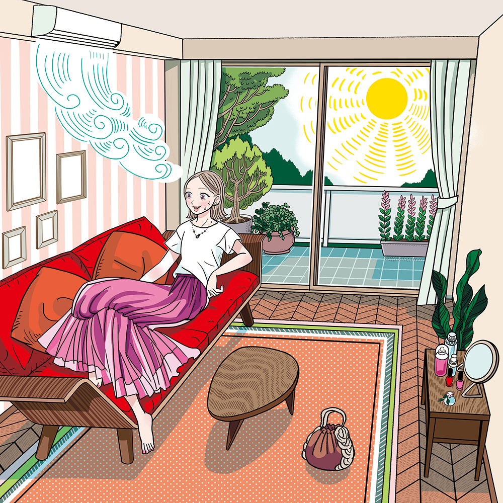 日差しの入る部屋でソファに座る女性