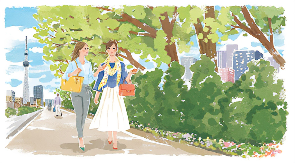 都会の公園を歩く二人の女性のイラスト